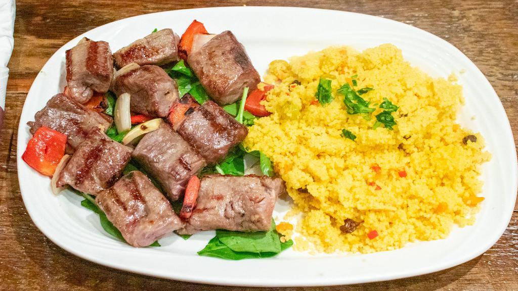Shish Kebab · Cubed London broil, seasoned, skewered and char grilled with onions and red peppers.