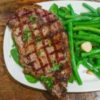 Rib-Eye Steak · Approximately one pound trimmed, boneless, seasoned and char-grilled to your liking.
