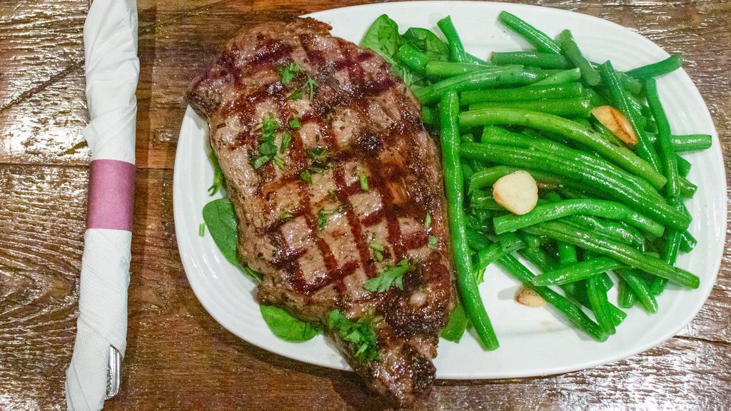 Rib-Eye Steak · Approximately one pound trimmed, boneless, seasoned and char-grilled to your liking.