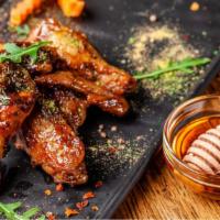 Honey Mustard Chicken Wings · Oven-baked chicken wings crispy to perfection topped with sweet honey mustard sauce. Served ...