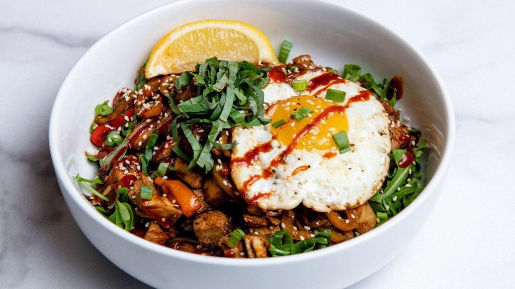 Chicken And Egg · Marinated chicken sautéed with KBBQ sauce, peppers & onions, marinated cucumbers, a fried egg, fresh arugula, basil, green onions, sesame seeds, and a side of gochujang sauce. Served with a lemon wedge and a base of your choice. (Gluten-free)