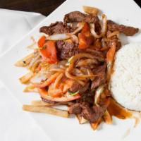 Lomo Saltado · Sliced beef sautéed with onions, tomatoes, and cilantro with rice and fries.
