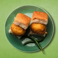Doughnut Slider · The dish consists of a deep-fried potato dumpling placed inside a bread bun sliced almost in...
