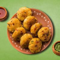 Divine Potato Croquette · Delicious snack made with boiled potatoes mixed with aromatic spices and herbs and fried til...