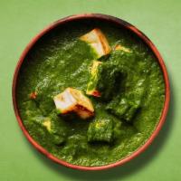 Green Cottage Curry · Indian cottage cheese cooked with fresh spinach an Indian herbs and spices and cream.