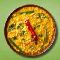 Lentil Fry League · Loosened yellow lentils cooked with spices, tomato, spinach, green chili, cumin and onions.