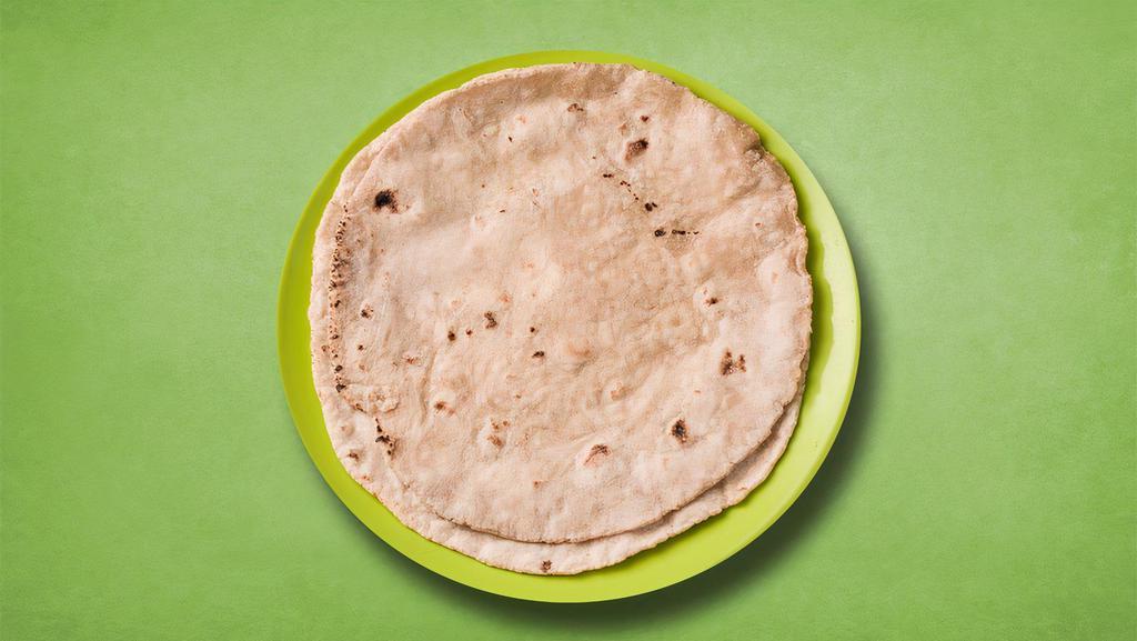 White Wheat Flat Bread · Whole wheat flat bread baked to perfection in an Indian clay oven