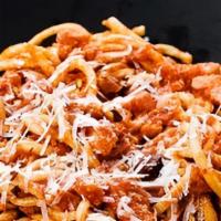 Veal Bolognese · Bucatini pasta, braised veal, and carrots, rustic tomato Barolo wine sauce.