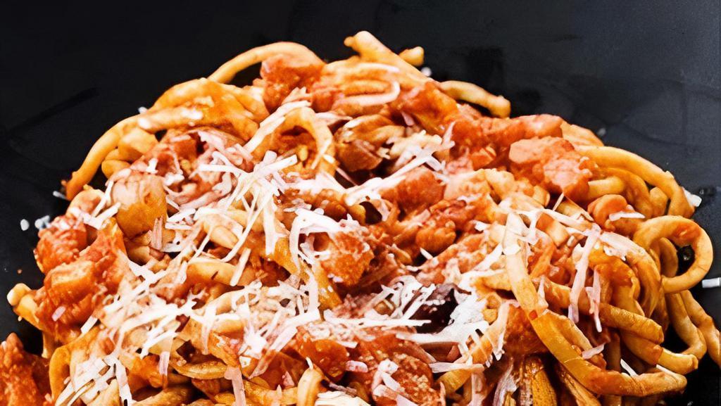 Veal Bolognese · Bucatini pasta, braised veal, and carrots, rustic tomato Barolo wine sauce.
