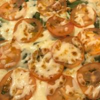 Garlic Spinach & Tomatoes · Garlic sauce, whole milk mozzarella cheese and sliced tomatoes.