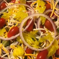 Garden · Mixed greens, grape tomatoes, shredded carrots, red onions, pepperoncini, cheddar jack cheese.