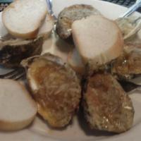 Char-Grilled Oysters · One dozen. Gulf oysters shucked and char-grilled with Mara's special butter sauce, bread cru...