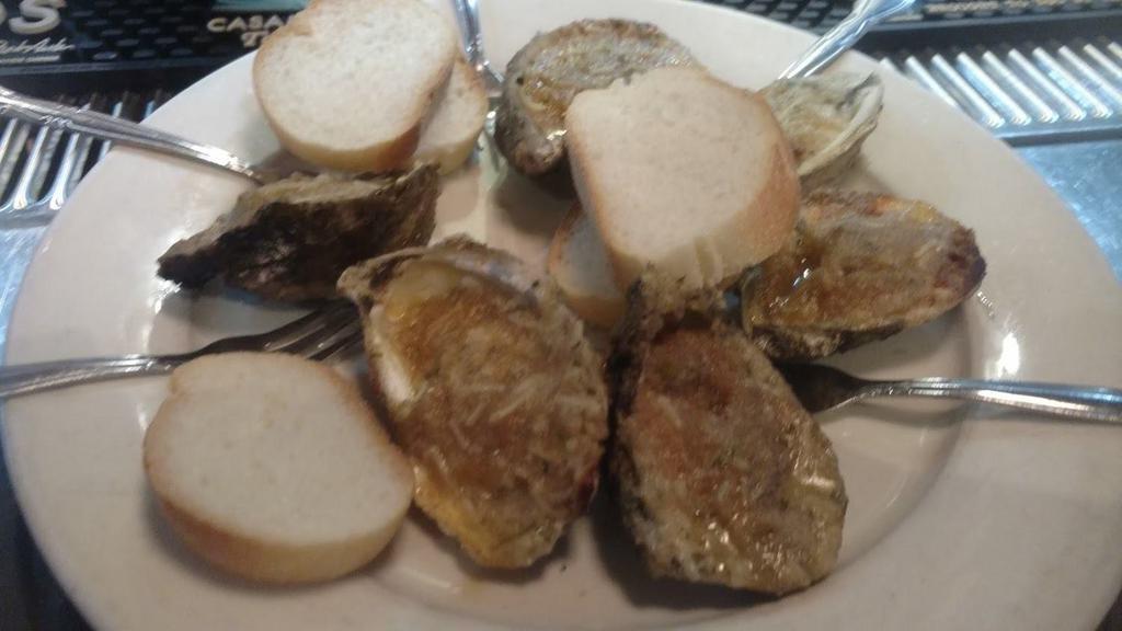 Char-Grilled Oysters · One dozen. Gulf oysters shucked and char-grilled with Mara's special butter sauce, bread crumbs, herbs, and cheeses. Served with bread on the side.