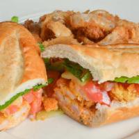 Po' Boy Cajun Hot Shrimp · Gluten-free. Fried Gulf shrimp, tossed with our cajun wing sauce (with butter), dressed with...