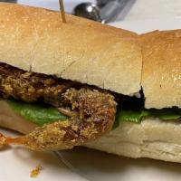 Soft Shell Crab Po'Boy · 2 jumbo soft shell crabs dusted in seasoned cornmeal, fried crisp, dressed with Remoulade sa...