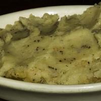 Garlic Mashed Potatoes · Gluten-free. Idaho potatoes hand mashed, mixed with butter, milk, sour cream, roasted garlic...