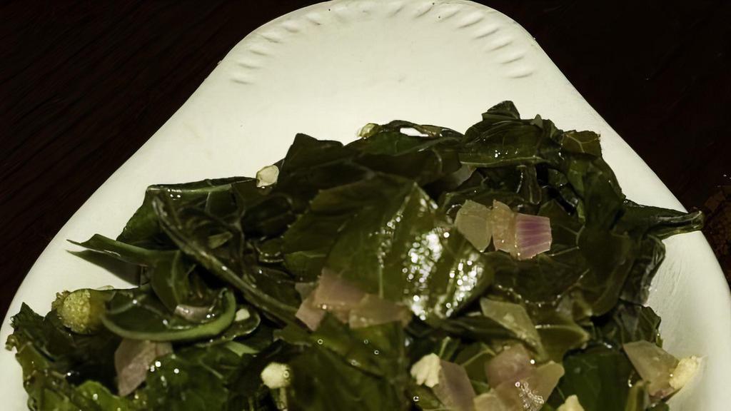 Sautéed Collard Greens · Gluten-free, dairy-free. With butter, garlic, onion, and a splash of crystal. Specify olive oil for dairy free. Vegan with olive oil.