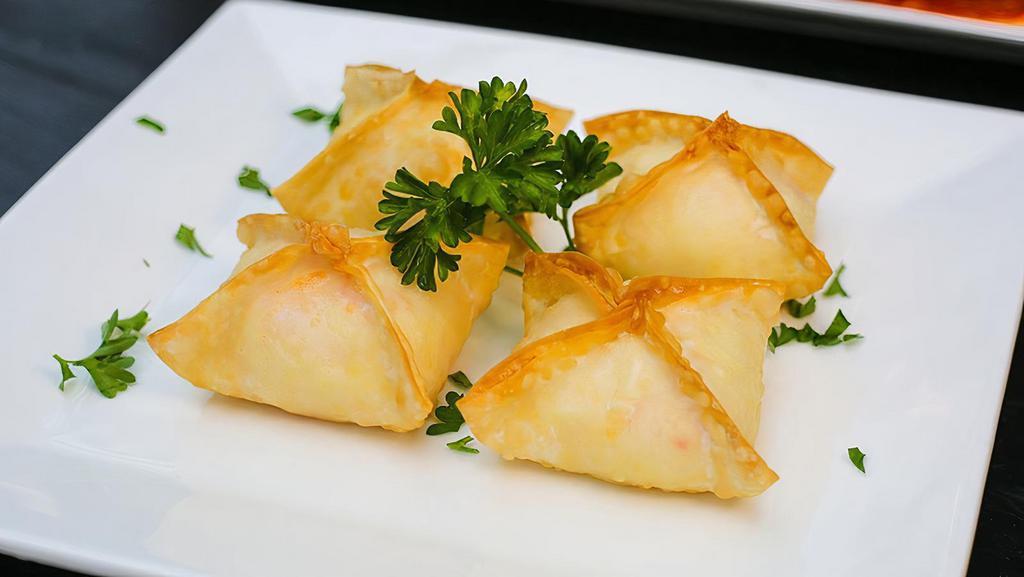 A3 Crab Rangoon (4) · Fried wonton filled w/ crab meat and cream cheese.