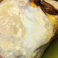 Breakfast Cuban · Open faced roast pork, ham, Swiss and egg on ciabatta w/ garlic aioli.