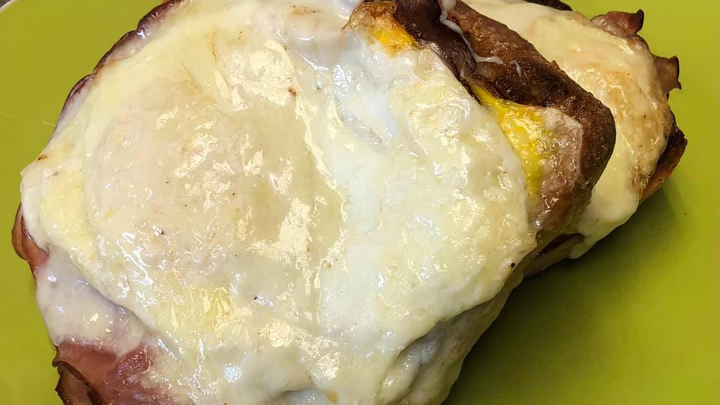 Breakfast Cuban · Open faced roast pork, ham, Swiss and egg on ciabatta w/ garlic aioli.