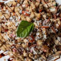 Panzanella Salad · Garlic croutons, mozzarella, basil, grape tomatoes, shaved Parmigiano reggiano, red onions, ...