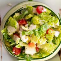 Millie'S Chopped Salad · Chopped romaine lettuce, feta cheese, green & red peppers, red onions, kalamata olives, slic...