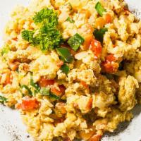 Huevos A La Mexicana · Scrambled eggs with jalapeños or green peppers, onions and tomato.