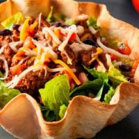 Ensalada De Taco · Crispy tortilla bowl with lettuce,beans, black olives, pico de gallo, guacamole, sour cream,...