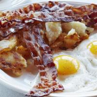 *Corned Beef Hash & Eggs · served with home fries, buttered toast and jelly