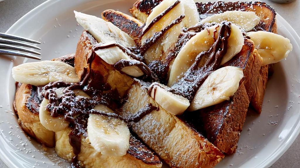 *Nutella Banana French Toast · our homemade thick cut hallah bread french toast topped with nutella and fresh cut bananas  **PLEASE NOTE - CAN NOT BE MADE GLUTEN FREE**
