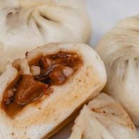 Char Siu Baos · steamed house-made bao, bbq berkshire pork, caramelized onion (3)