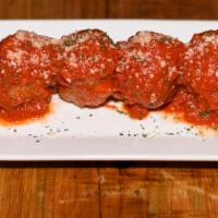 Polpette Al Sugo · Slowly cooked meatballs in tomato sauce.