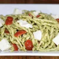 Fusilli Al Pesto · Fresh Fusilli pasta with pesto sauce, cherry tomatoes and fresh mozzarella.