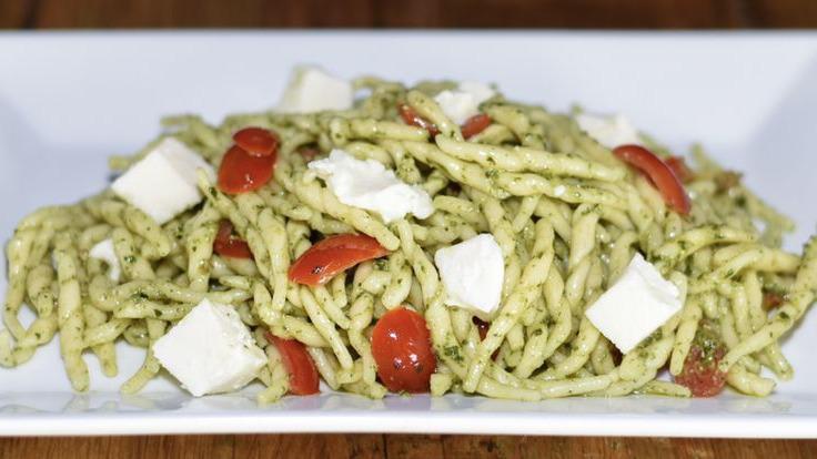 Fusilli Al Pesto · Fresh Fusilli pasta with pesto sauce, cherry tomatoes and fresh mozzarella.
