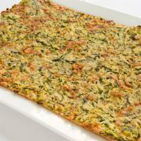 Zucchini · Flatbread topped with sliced zucchini, gruyere cheese, and bread crumbs.