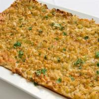 Cavolfiore · Flatbread topped with cauliflower, gruyere cheese, and bread crumbs.