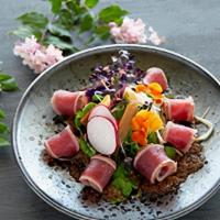 Tuna Tataki Salad · Seared tuna mixed green with onion dressing.
