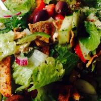 Greek Salad · Mix of organic greens and fresh lettuce, tomatoes, chopped fresh cucumber, green peppers, sl...