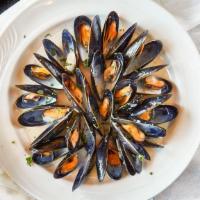 Mussels · Steamed mussels served in a light marinara sauce or in a garlic, white wine sauce.