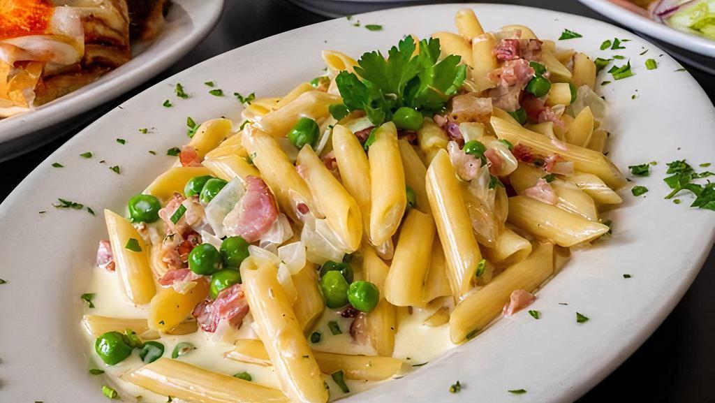 Pasta Carbonara · Bacon, onions, peas, and parmesan cheese in a cream sauce.