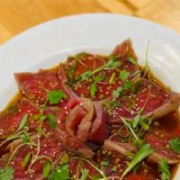 Seared Tuna Tataki · Six pieces of pepper tuna, served with yuzu sauce.