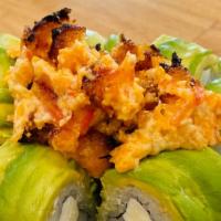 Volcano Roll · Kani, cream cheese, avocado in a roll, deep fried and topped with spicy tuna, spicy salmon, ...