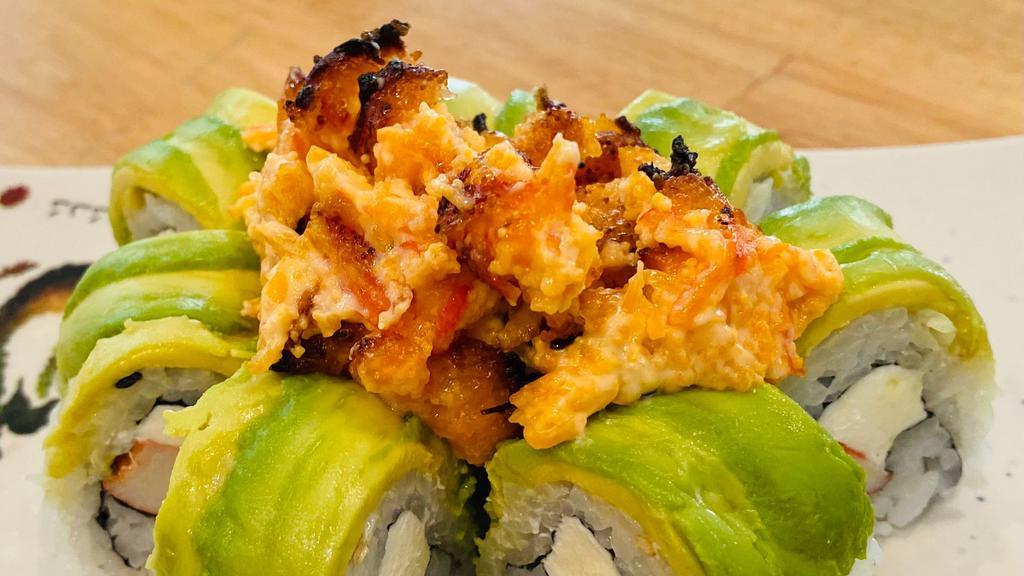 Volcano Roll · Kani, cream cheese, avocado in a roll, deep fried and topped with spicy tuna, spicy salmon, tobiko and spicy eel sauce.