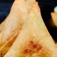 Sexy Samosas · Idaho potatoes fried in a crispy wheat layer fried, served with tamarind.