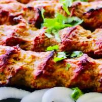 Seekh Kebab · Ground meat seasoned with mint and herbs rolled on a skewer.