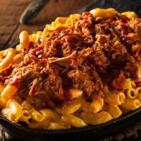 Bbq Pulled Pork Mac · Pulled pork tossed in BBQ sauce on top of cavatappi noodles with homemade cheese sauce.