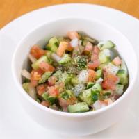 Persian Salad (Shirazi Salad) · A mixture of fresh diced cucumbers, tomatoes, onions, olive oil, fresh lime juice, and mint.