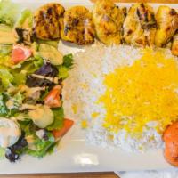 Chicken Kebob (Jujeh Kebob) · A juicy strip of grilled marinated chicken served with basmati rice, garden salad and a gril...