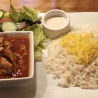 Chicken Stew (Khoresht-E Morgh · Steamed boneless chicken, sautéed onions in a fresh tomato based sauce, served with a basmat...