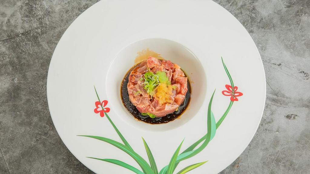 Tuna Tartar · With avocado and quail egg.